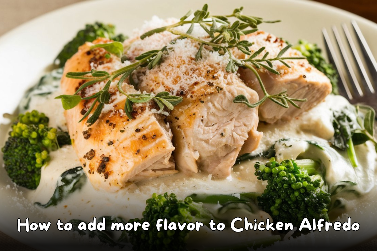 Close-up of a Chicken Alfredo dish topped with fresh herbs and served with creamy Alfredo sauce, broccoli, and spinach.