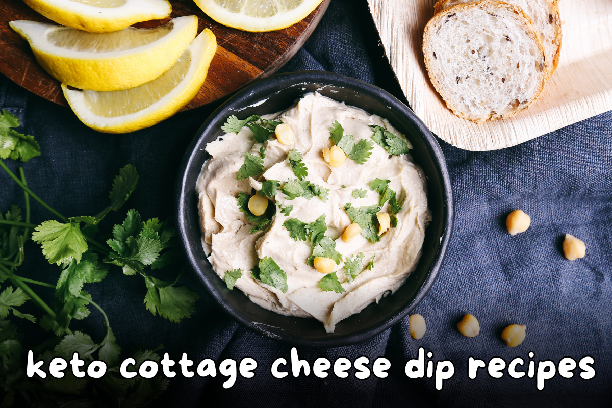 Keto cottage cheese dip served in a bowl with fresh herbs, lemon wedges, and bread slices.